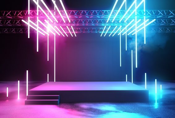 indoor stage and lighting A brightly lit stage with vibrant pink and blue vertical lights and a smoky backdrop.